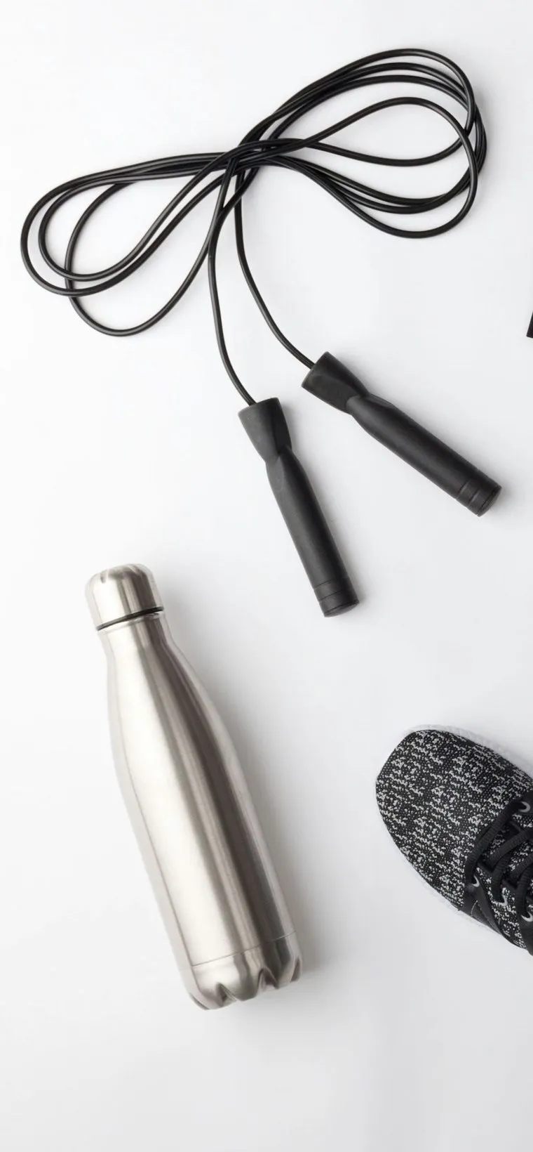 A skipping rope and a steel water bottle