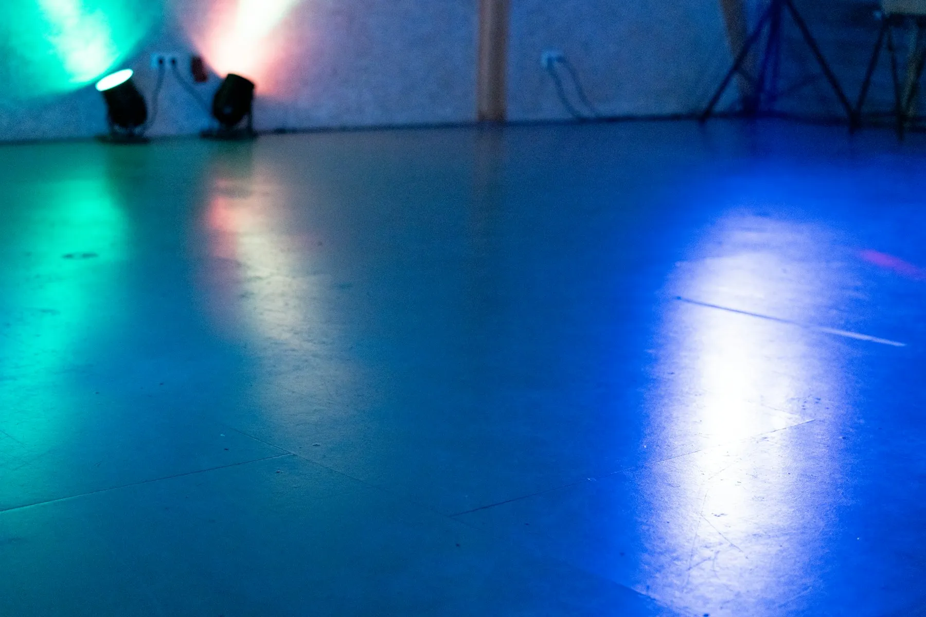 Coloured lights on an empty studio floor